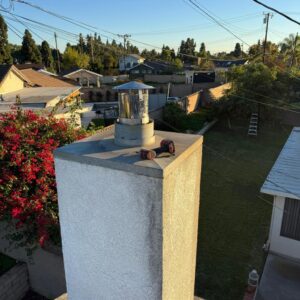 Stovepipe chimney installation on rooftop in Kansas with professional vent setup